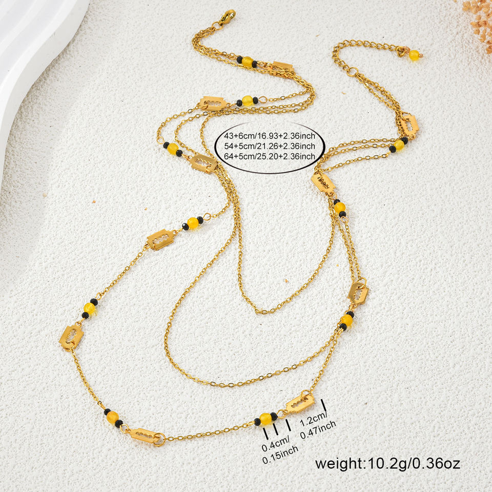 Layered geometric necklace detail